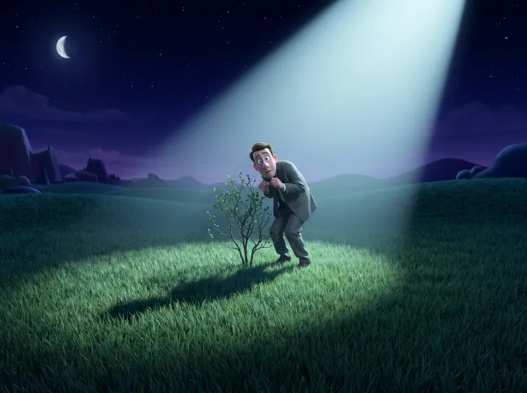 Homme en costume se cachant mal du projecteur